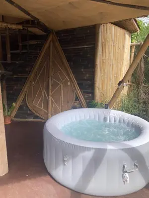 a hot tub in front of a building at Bambuk Bio Chalet Uvita Beach Front in Uvita