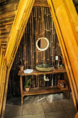 a bathroom with a sink in a bamboo house at Bambuk Bio Chalet Uvita Beach Front in Uvita