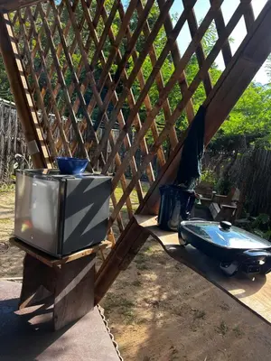 a tv and a toilet sitting under a fence at Bambuk Bio Chalet Uvita Beach Front in Uvita