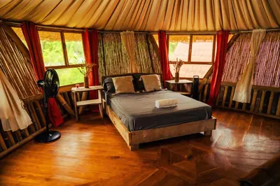 a bedroom with a bed in a yurt at Bambuk Bio Chalet Uvita Beach Front in Uvita