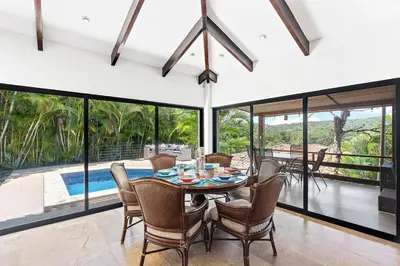 a dining room with a table and chairs at Spacious Villa Retreat in Private Resort in Playa Hermosa