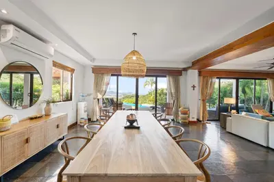 a large living room with a wooden table and chairs at Spectacular Ocean Views Infinity Pool in Potrero