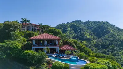 a house on top of a hill with a swimming pool at Spectacular Ocean Views Infinity Pool in Potrero