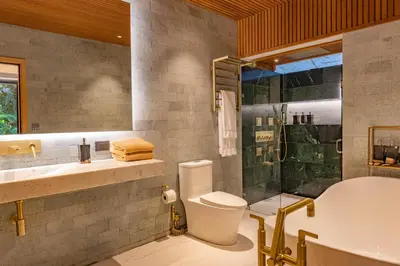 a bathroom with a toilet and a sink and a shower at Tifakara by the Waterfall in Fortuna