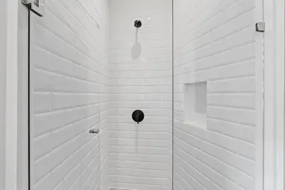 a white shower with a glass door in a bathroom at Stylish Condo in the Heart of Las Catalinas with Vibrant Design & Exclusive Beach Club Access in Playa Danta