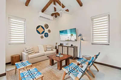 a living room with a couch and a table at Stylish Condo in the Heart of Las Catalinas with Vibrant Design & Exclusive Beach Club Access in Playa Danta