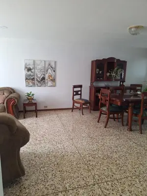 a living room with a piano and chairs at Linda y céntrica habitación in Alajuela City