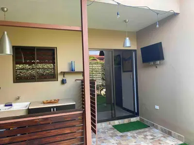 a bathroom with a shower and a sink and a tv at Hermosa Casa con todos los servicios a la mano in Barrancas