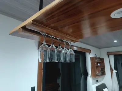 a group of wine glasses hanging from a ceiling at Athila Ecolove in Monteverde Costa Rica
