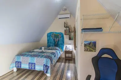 a bedroom with a bed and a bunk bed at Bamboo Relax Uvita in Uvita