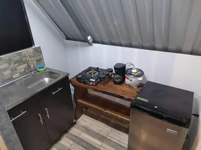 a small kitchen with a counter and a sink at Bamboo Relax Uvita in Uvita