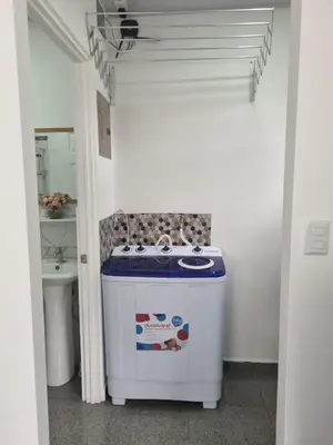 a small bathroom with a sink and a stove at Villas Azul in Tamarindo