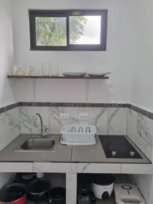 a kitchen with a sink and a window at Villas Azul in Tamarindo