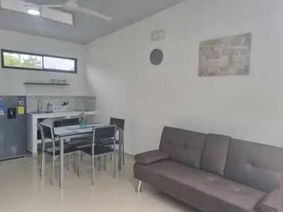 a living room with a couch and a table at Villas Azul in Tamarindo