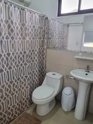a bathroom with a toilet and a sink at Villas Azul in Tamarindo