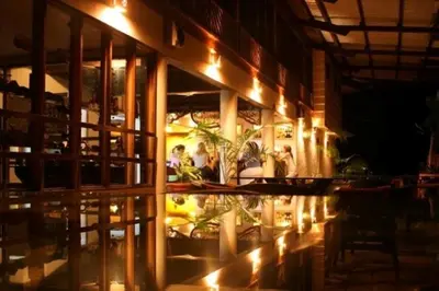 a restaurant with lights on the side of a building at Selva Verde Lodge in Sarapiquí