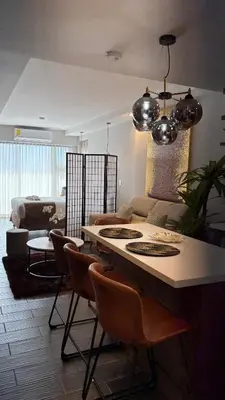 a kitchen and living room with a table and chairs at Luxury apartment 10 min to Airport Be Cariari Condo #402 in La Asunción