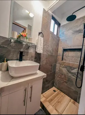 a bathroom with a sink and a shower at Renovated apartment in Las Palmas in Coco