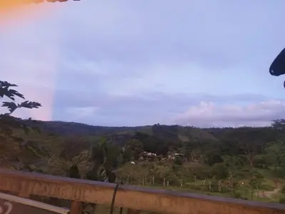 a view of a mountain with a house on a hill at Cabañas venado in Venado