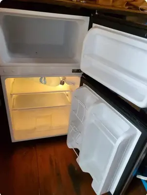 an open refrigerator with its door open and its contents at Beachfront sunset Bungalow in Boca de Ario