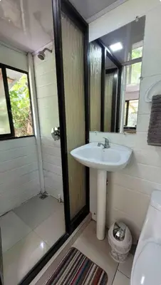 a bathroom with a sink and a shower at Beachfront sunset Bungalow in Boca de Ario