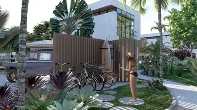 a woman in a bikini standing next to a fence with bikes at Soleil Samara in Sámara
