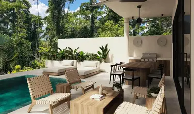 a patio with a table and chairs and a pool at Soleil Samara in Sámara