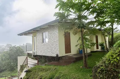 a small house on the side of a hill at Hilltop Bungalow #1 W Spectacular Volcano View in El Fosforo
