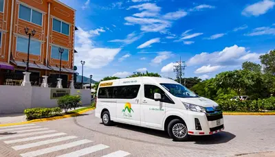 a white van parked in front of a building at Narime Costa Rica in Palmira