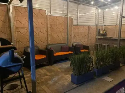 a room with couches and potted plants at Difas in Coyol