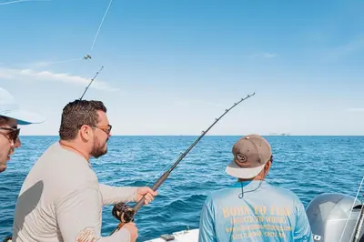 three men fishing on a boat in the ocean at Mercado 26- Ocean View Condo At Las Catalinas in Playa Danta