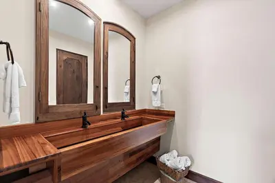 a bathroom with a wooden sink and a mirror at Beautiful Villa Walk to Beach in Playa Danta