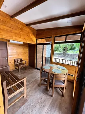 a dining room with a table and chairs at Eco Casa Mango Lepanto #9 in Lepanto