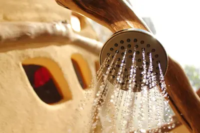a shower head with water coming out of it at Camino Nuevo Monteverde Ecolodge in Monteverde Costa Rica