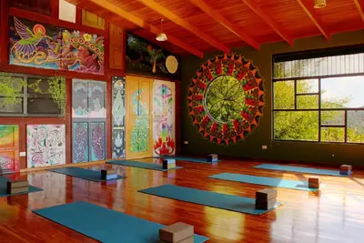 a room with a bunch of yoga mats in it at Camino Nuevo Monteverde Ecolodge in Monteverde Costa Rica