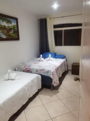 a bedroom with two beds with towels on them at VillaLore piscina exclusiva BBQ AC max 11 personas 5min playas in Carpintero