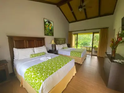 a bedroom with two beds in a room at Hotel Boutique Casona del Cafetal and Lakeside Restaurant in Cachí