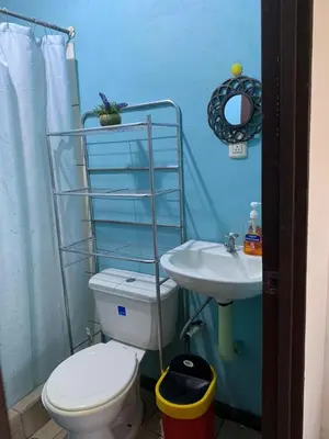 a bathroom with a toilet and a sink at Alicama in Puerto Limón