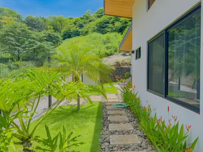 a garden view from the side of a house at Coco Luna House 2 bed 3 bath in Coco