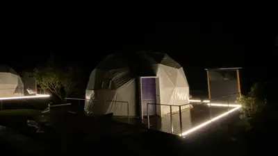 a night view of a dome shaped house with lights at FERNANDA Dome at FéLIZA Rainforest Domes in Monteverde Costa Rica