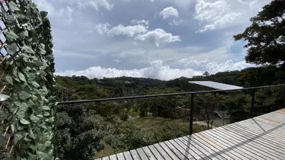 a view from the balcony of a house at FERNANDA Dome at FéLIZA Rainforest Domes in Monteverde Costa Rica
