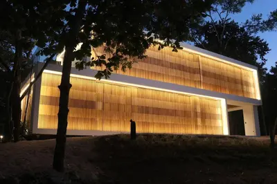 a building with a person standing in front of it at Playa Conchal and Minas' Hidden Gem in Puerto Viejo