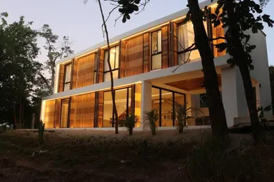 a large building with a lot of windows at Playa Conchal and Minas' Hidden Gem in Puerto Viejo