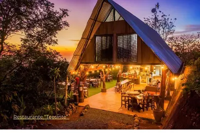 a house with a blue tarp on top of it at Nosara Hideaway 1 - Mountain View Cabins & BREAKFAST PROVIDED in Naranjal