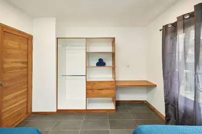 a room with a closet with shelves and a door at Green Turtle Townhome #3 Private Pool & Garden 300 Mt to Beach in Tamarindo