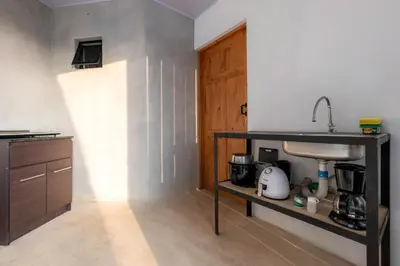a kitchen with a sink and a counter at Zen Studio in Jacó