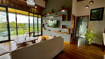 a living room with a couch and a table at Casa horizonte Verde in Sierra