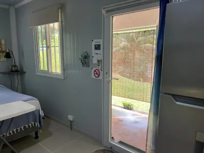 a room with a door leading to a patio at Ojochal maison moderne piscine creusée in Ojochal