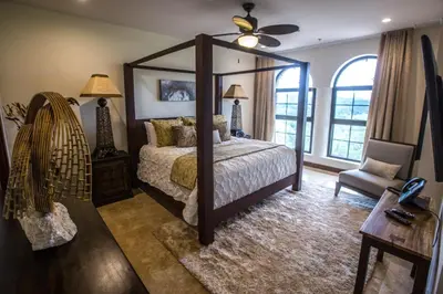 a bedroom with a large bed with a large mirror at Spectacular 3 bedroom Penthouse at Crocs Resort Casino in Jacó