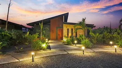 a house with a courtyard at night with lights at Serene Hills in Fortuna